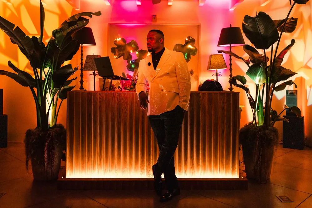 DJ M.O.S. behind the decks at a private event