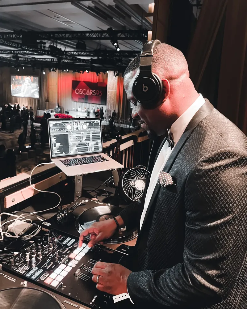 DJ M.O.S. in a tuxedo behind the decks at the 95th Academy Awards