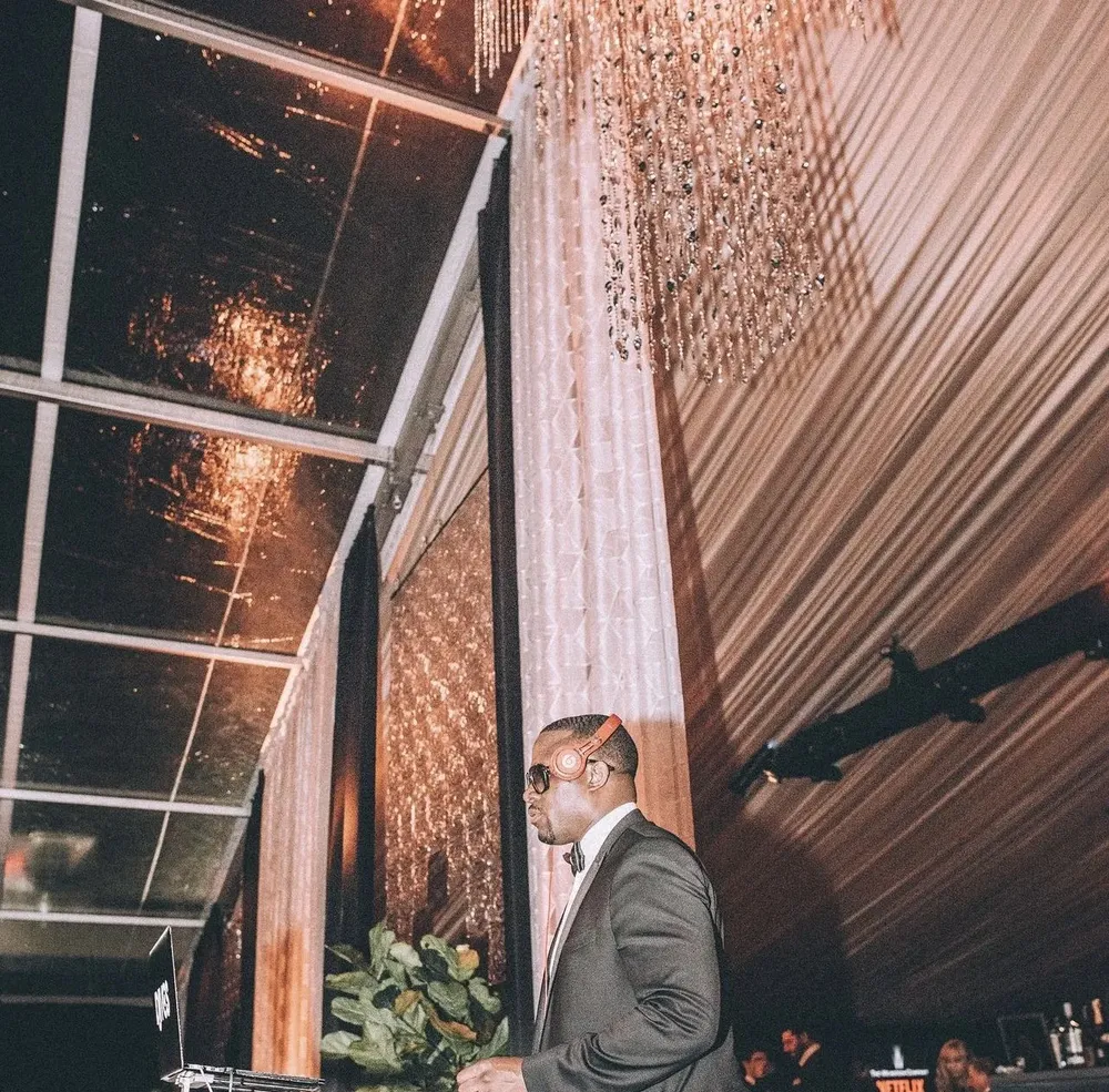 DJ M.O.S. in black tie at an awards-season Netflix party