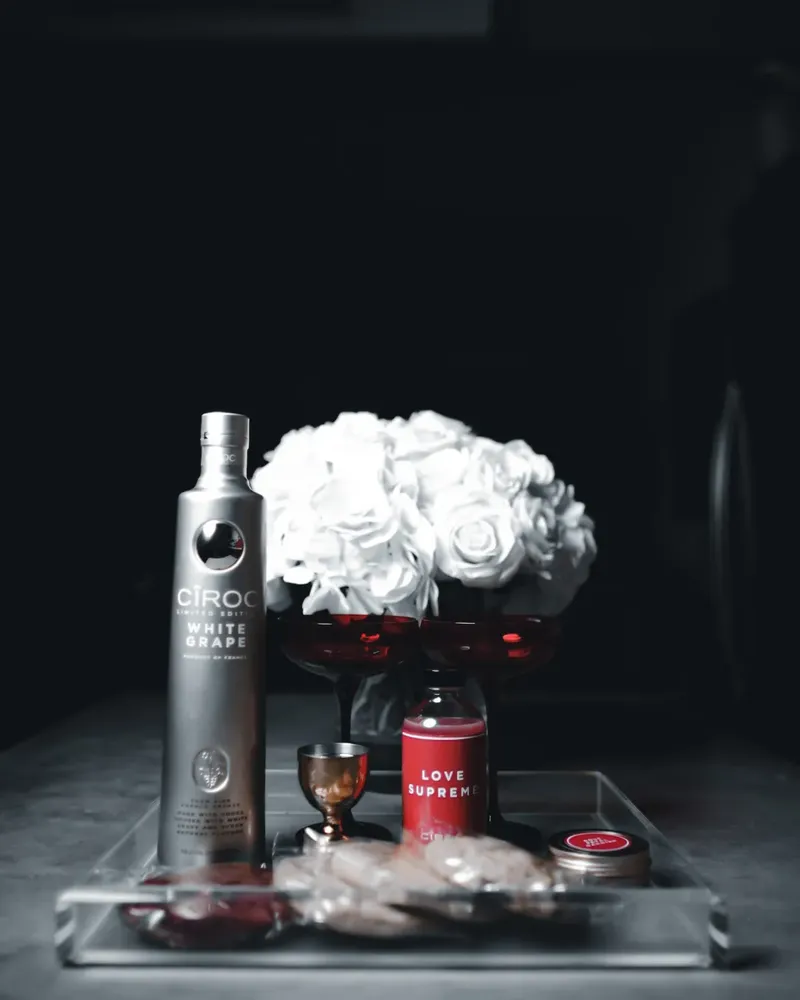 CÎROC White Grape limited-edition bottle styled with white roses and red coupes