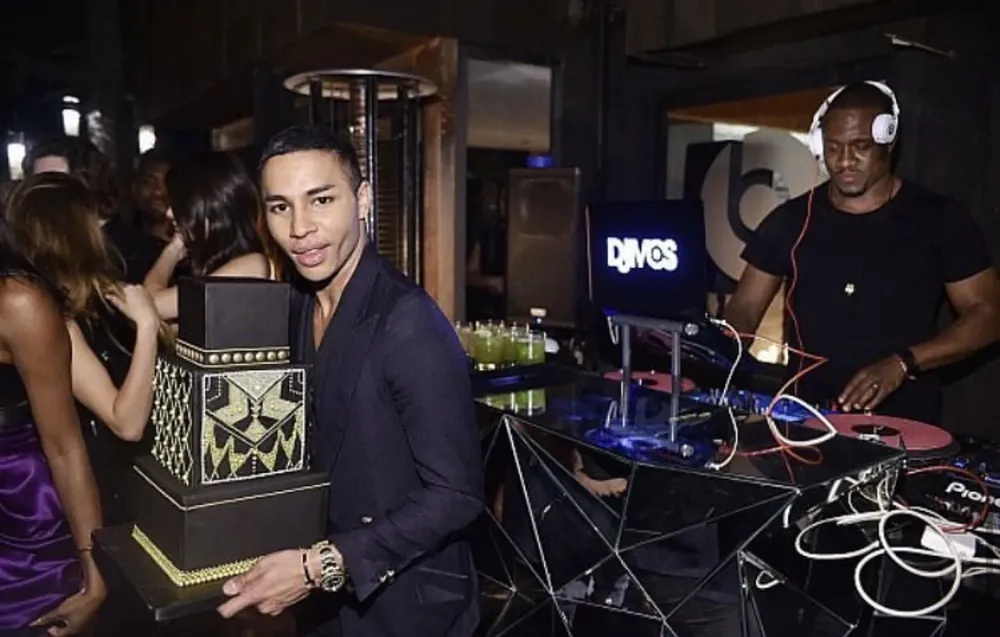 DJ M.O.S. behind the decks at the branded booth during a private event